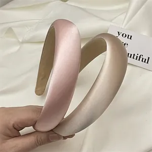 Elegant satin padded headbands in pink and beige colors for voluminous hair style