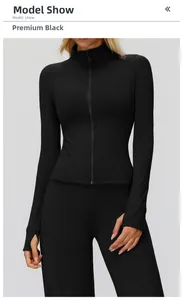 Detail of black slim-fit zip jacket featuring standing collar and functional thumbholes
