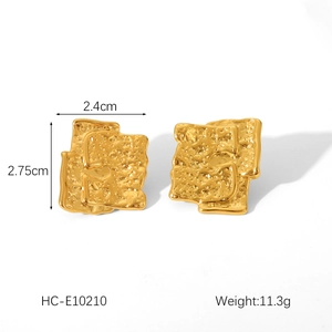 Detail view of 18K gold plated stainless steel square earrings with hammered texture