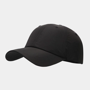 Detail of water-resistant black baseball cap showing triple-stitched brim and breathable vents