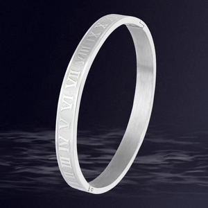 Silver stainless steel bangle featuring roman numeral engravings on a textured finish