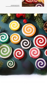 Flat lay of colorful swirl peppermint candy ornaments with Christmas pine decorations