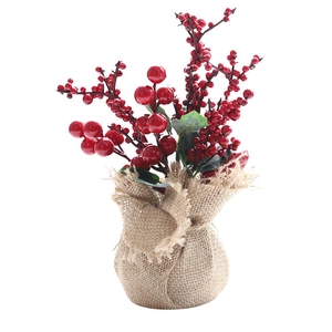 Mini artificial Christmas tree with red berries and burlap base for desk decoration