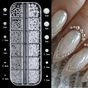 Detail view of nail art pearls and silver steel beads in various sizes with application display