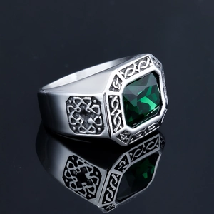 Vintage stainless steel ring with emerald-cut green stone and Celtic knot engravings