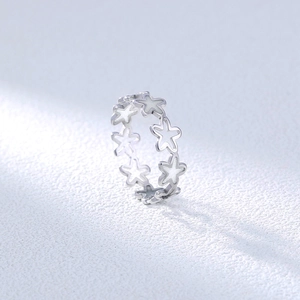 Detailed macro view of 304 stainless steel ring with luminous hollow star pattern