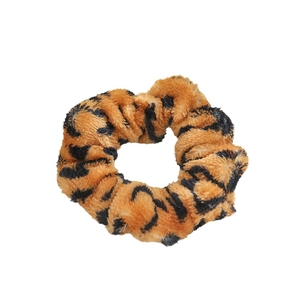 Plush leopard print scrunchie in brown and black faux fur for retro hair styling