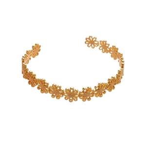 Elegant gold cutout daisy flower open bangle bracelet with a minimalist vintage metal finish