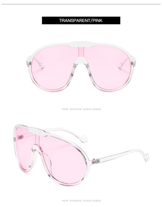 Detail view of transparent frames with pink lenses and heart-shaped temple accents