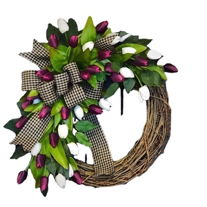 Handmade spring tulip wreath with purple flowers and gingham bow on natural rattan base