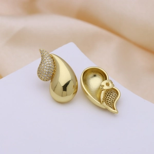 Detail showing the 18k gold plated water drop earrings with white pavé zircons
