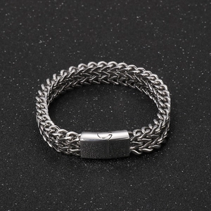 Close-up of silver stainless steel double-layer braided chain bracelet with flat buckle