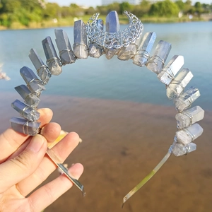 Detailed macro view of the metal crescent moon on a crystal crown with wire wrapping