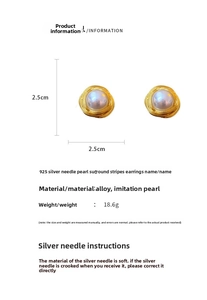 Detailed macro of vintage style 925 silver needle pearl stud earrings with spiral texture