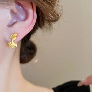 Chic 3D gold goldfish stud earrings for women with a sleek metallic finish and silver pins