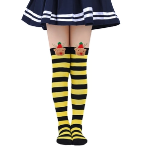 Detail of yellow and black striped over-knee socks with a 3D reindeer plush head decor
