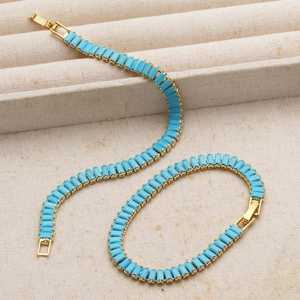 Luxurious 18K gold plated bracelet with sky blue turquoise inlays and fold-over clasp
