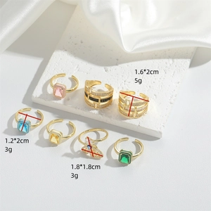 Set of 7 gold adjustable open rings featuring colorful square zircon and planetary designs
