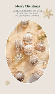 Detail of Christmas tree ornaments featuring lace patterns, pearls and gold glitter textures