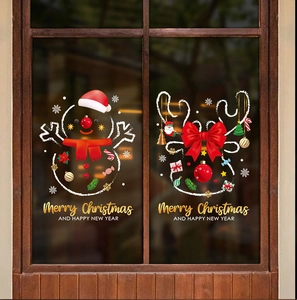 Close-up of Christmas window stickers with snowman, reindeer and Merry Christmas text