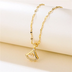 Elegant gold fan-shaped necklace with floating crystal on a minimalist stand