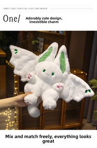 Detail showing plush rabbit doll with green wings and pink heart-shaped paw pads