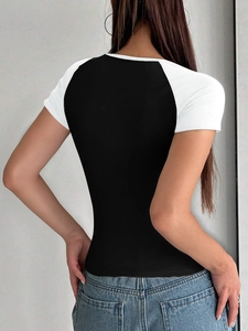 Slim fit Y2K T-shirt showing contrast back detail with black body and white sleeves