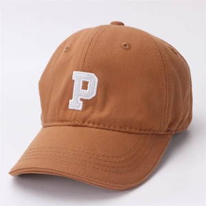 Detail view of brown cotton baseball cap with white embroidered P letter and visor curve