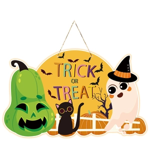 Halloween hanging ornament with green pumpkin, black cat, and Trick or Treat text on yellow base