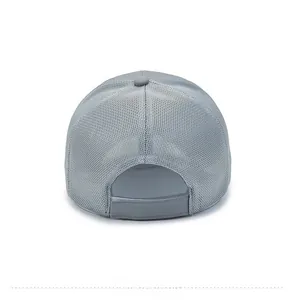 Detail view of breathable grey mesh baseball cap featuring an adjustable velcro strap
