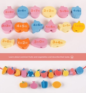 Detailed view of wooden fruit blocks and math addition beads for educational learning