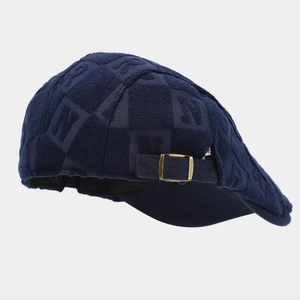 Retro dark blue newsboy cap with embossed N pattern and adjustable gold metal buckle