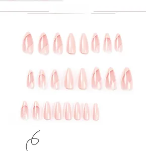 Flat lay of 24 pieces light pink almond shaped press-on nails in various sizes