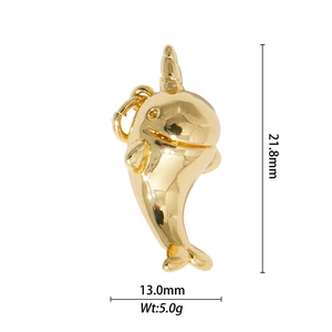 Macro view of gold narwhal pendant with dimensions 21.8mm height and 5.0g weight