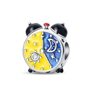Macro view of alarm clock charm with sun and moon enamel for bead bracelets