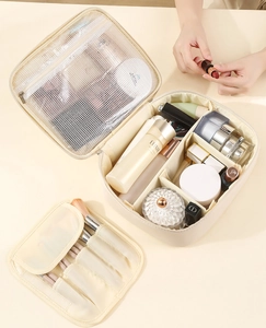 Macro view of interior storage compartments and separate brush bag for makeup pouch