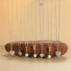Elegant collection of heart pendant necklaces and pearl necklaces in gold and silver finish