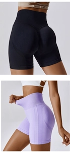 Detail showing high-waisted seamless ribbed waistband and breathable mesh texture on shorts