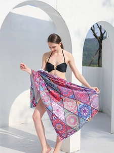 Close-up of bohemian mandala print quick-dry beach towel draped over a female model