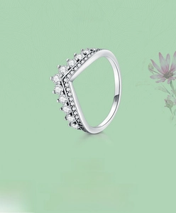 Macro shot of S925 sterling silver V-shaped chevron ring with sparkling white zircons