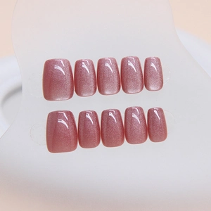 Pink cat eye press-on nails with square round shape and shimmering pearlescent finish