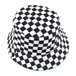 Detailed top view of reversible black and white checkered bucket hat fabric and texture
