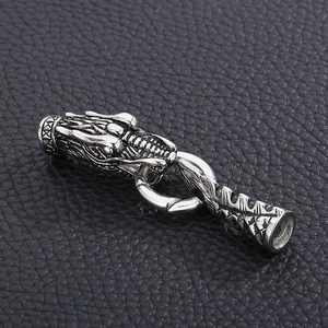 Macro view of a silver stainless steel dragon head clasp with detailed scale engraving