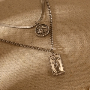 Double-layered silver necklace with celestial coin and The Star tarot card pendant