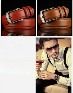 Detail of genuine leather belt with brushed copper buckle in brown and tan tones