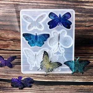 Détails du moule en résine papillon avec textures d'ailes et exemples de créations colorées