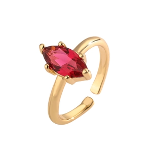 Detail of marquise-cut red gemstone on gold-plated adjustable ring with four-prong setting