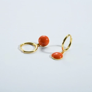 Detail of S925 sterling silver gold-plated orange earrings with hallmark engraving