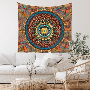 Macro view of large colorful mandala tapestry hanging on wall over a white sofa