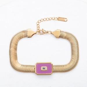 Detail of lobster clasp and adjustable chain on gold stainless steel snake bracelet